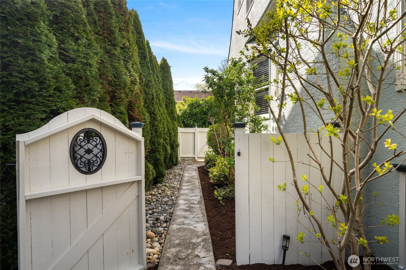 1507 15th Street Anacortes, WA 98221 - Photo 23 of 40 a front view of a house with a garden