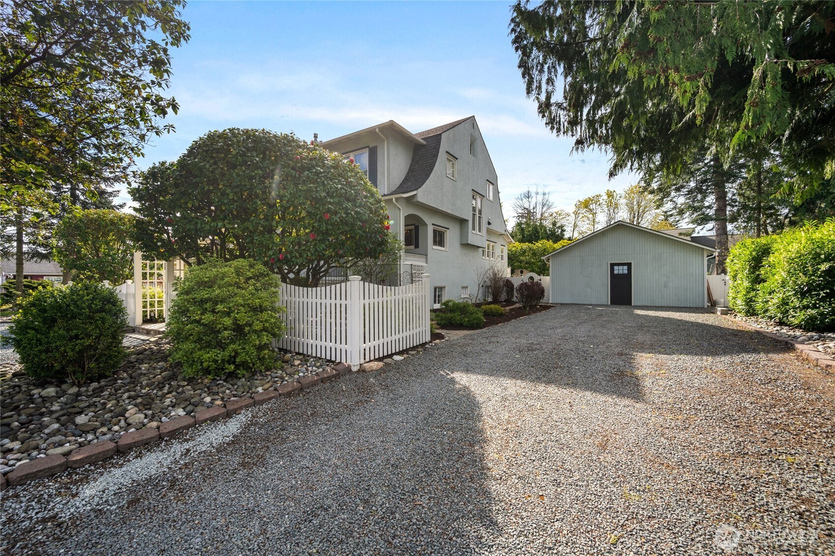 1507 15th Street Anacortes, WA 98221 - Photo 25 of 40 a front view of a house with a yard and garage