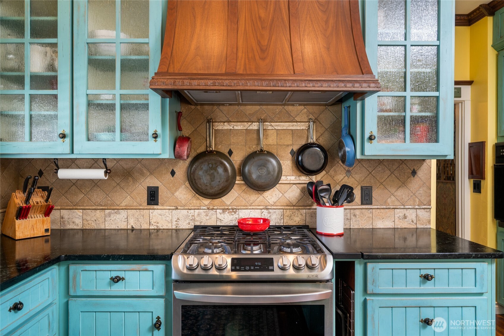 1507 15th Street Anacortes, WA 98221 - Photo 36 of 40 a kitchen with a stove and cabinets