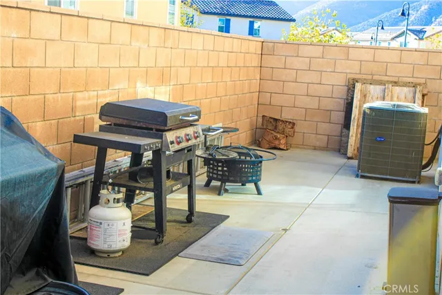 a view of a chairs and table in the patio