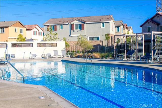 a front view of a house with a swimming pool