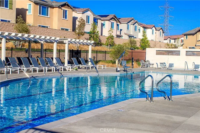a kitchen with stainless steel appliances wooden cabinets and stove top oven