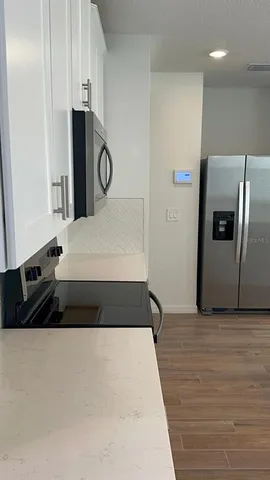 a large white bed in a white room