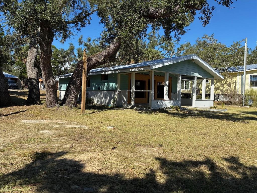 1170 Whiddon Avenue Cedar Key, FL 32625 - Photo 3 of 8 a view of a house with snow on the ground