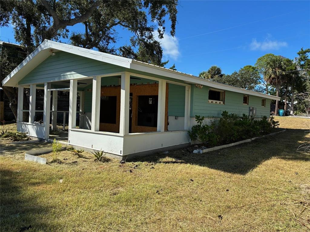 1170 Whiddon Avenue Cedar Key, FL 32625 - Photo 4 of 8 a front view of a house with garden