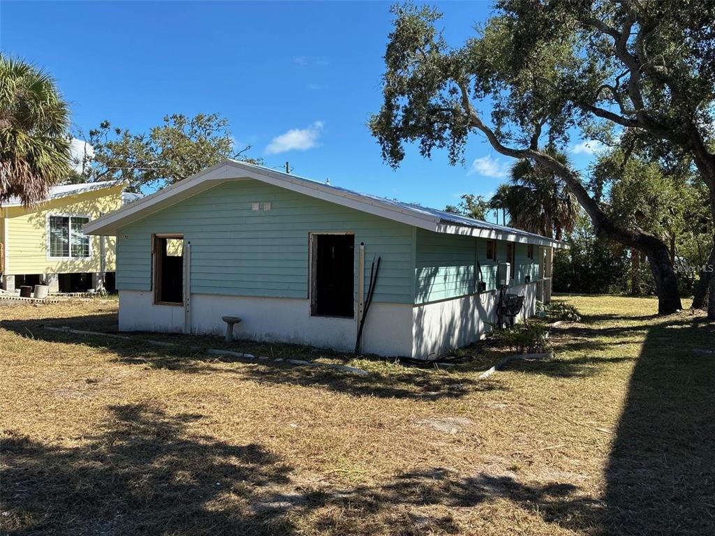 1170 Whiddon Avenue Cedar Key, FL 32625 - Photo 6 of 8 a view of a house with a yard