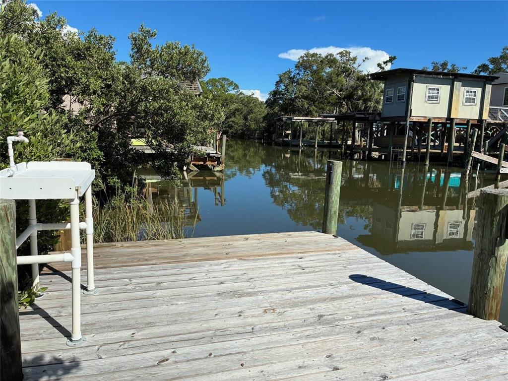 1170 Whiddon Avenue Cedar Key, FL 32625 - Photo 8 of 8 a wooden pier with boats and lake view