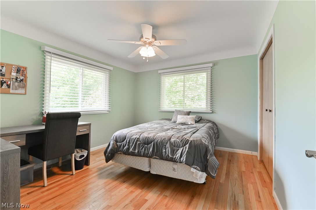 2725 Rockefeller Road Willoughby Hills, OH 44092 - Photo 11 of 21 Bedroom featuring light wood-type flooring, multiple windows, and ceiling fan