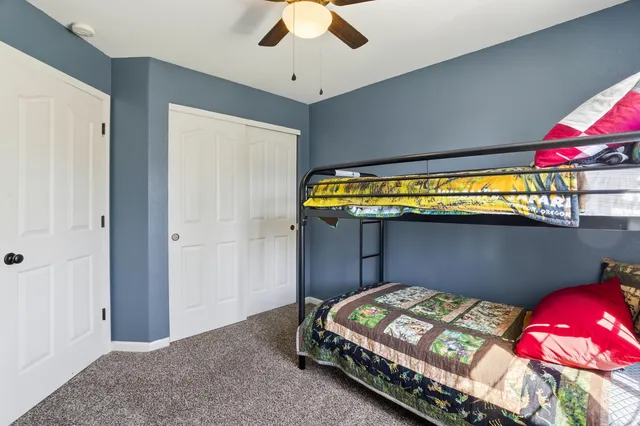 a bedroom with bed and window