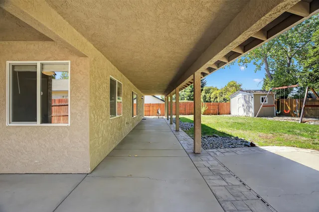 a view of a house with brick walls