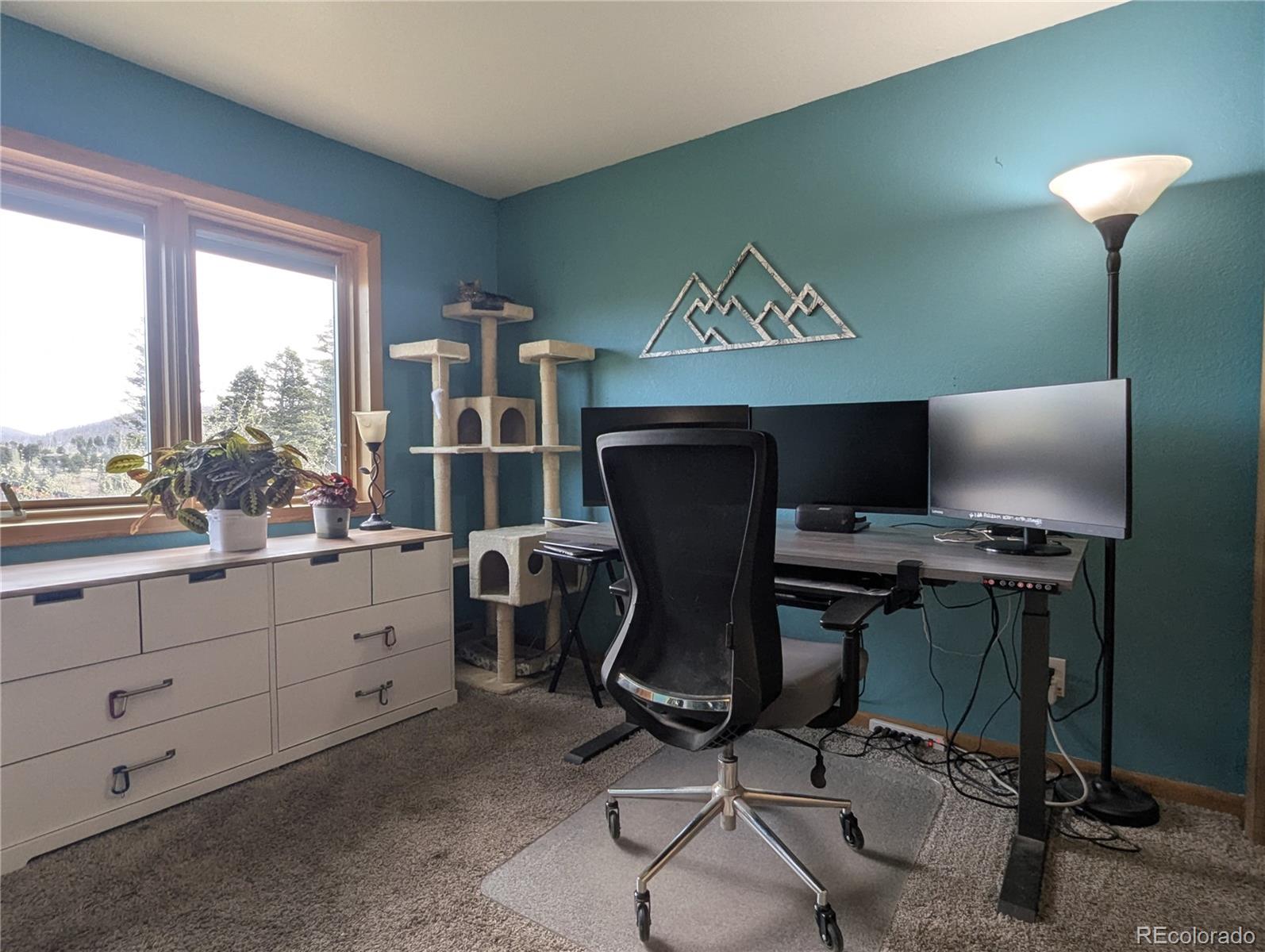 2084 Forbes Park Road Fort Garland, CO 81133 - Photo 30 of 39 a view of workspace with wooden floor windows