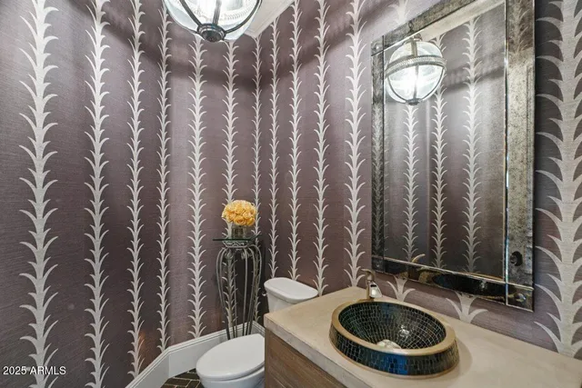 a kitchen with counter top space and living room