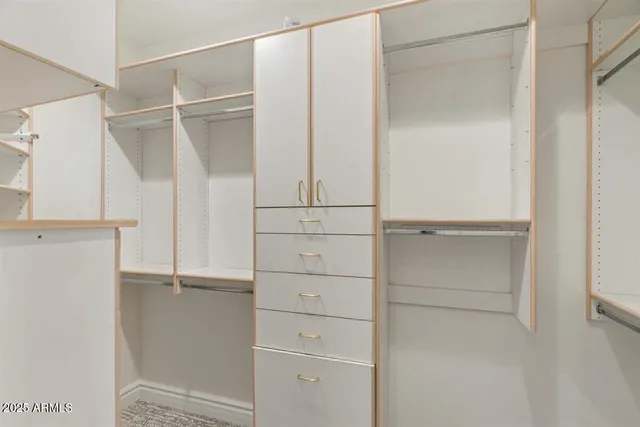 a view of living room with furniture and floor to ceiling window