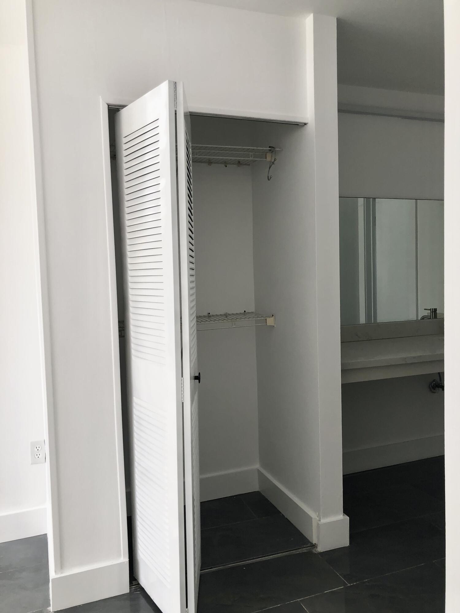 6850 Royal Palm Boulevard, Unit 104G Margate, FL 33063 - Photo 13 of 17 a view of closet area