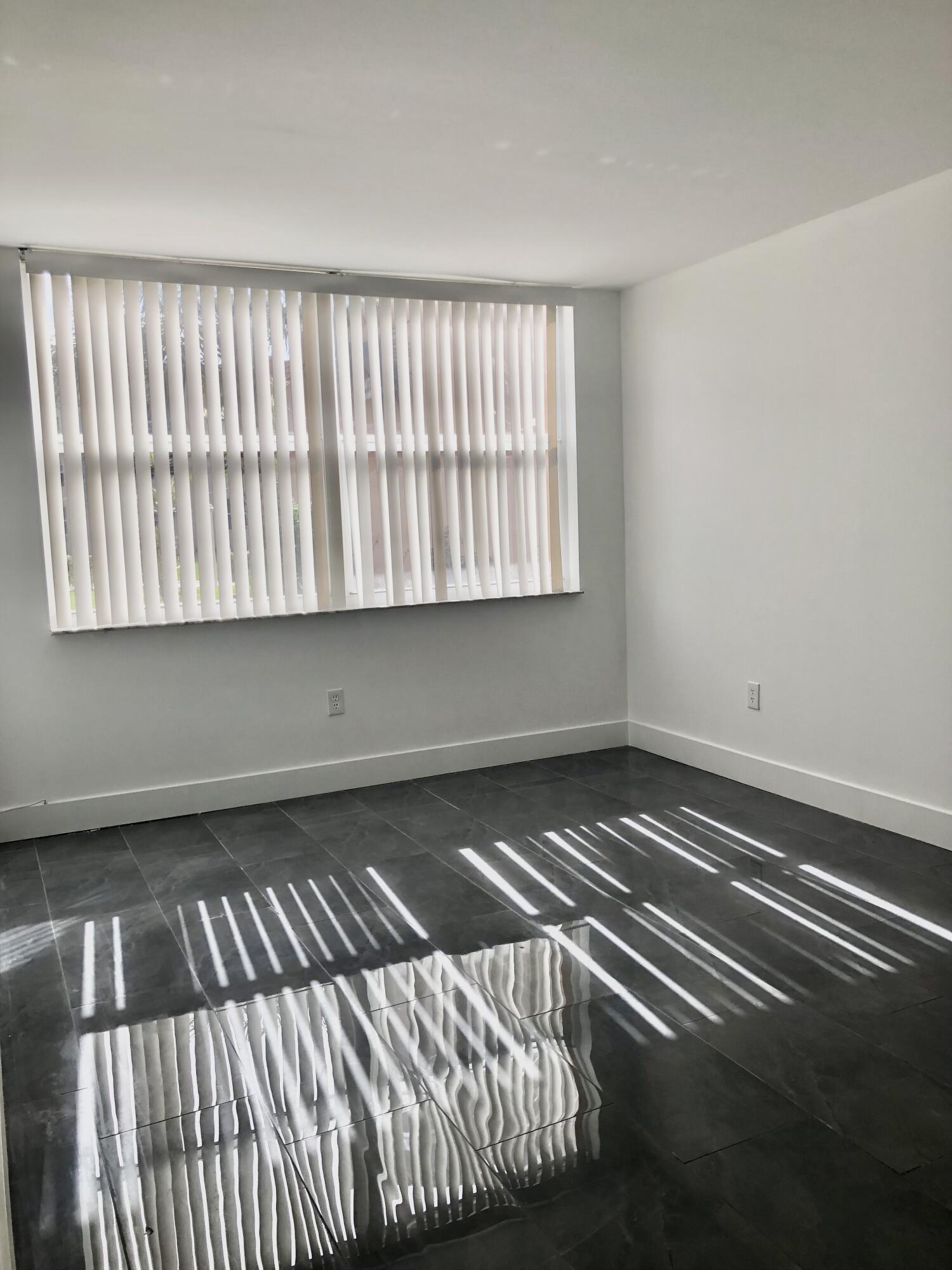 6850 Royal Palm Boulevard, Unit 104G Margate, FL 33063 - Photo 15 of 17 a view of a room with an empty space