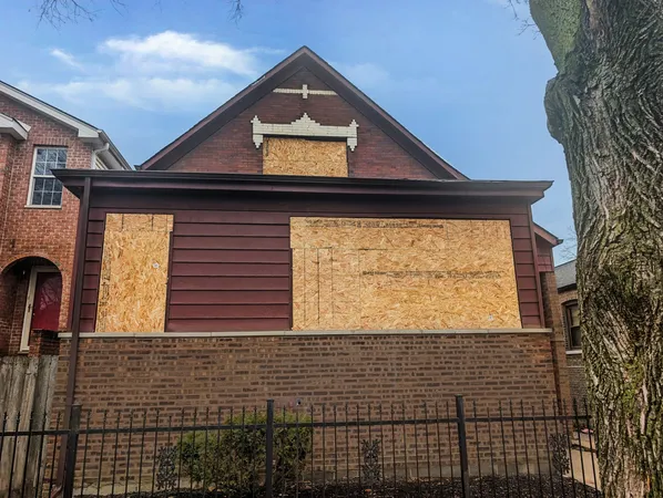a view of a brick house with a large window