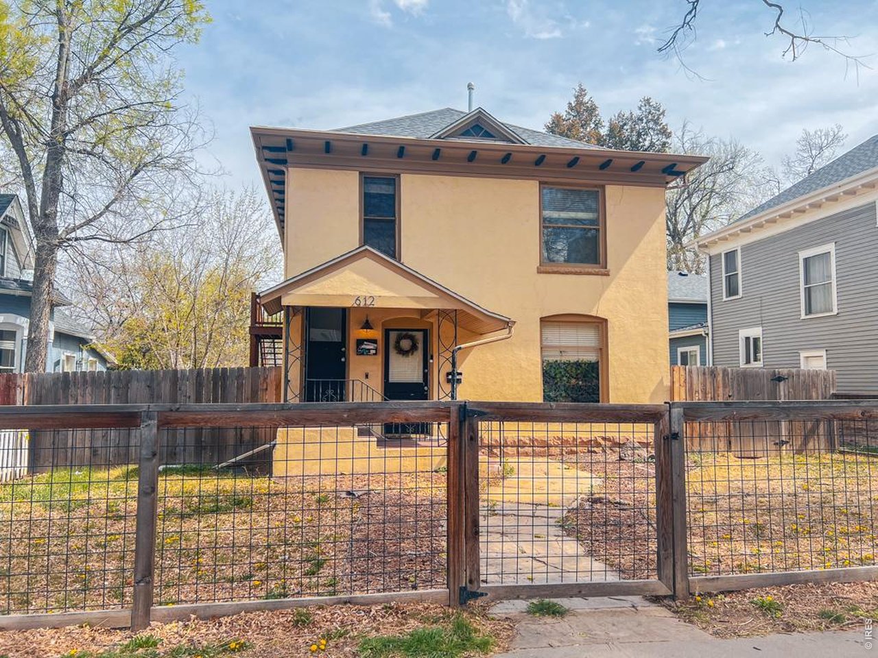 612 South Howes Street Fort Collins, CO 80521 - Photo 1 of 18 a front view of a house with glass windows