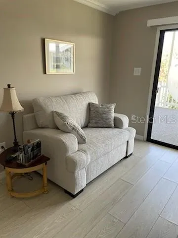 a living room with furniture and a window