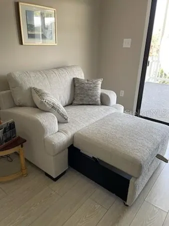 a bedroom with bed and window