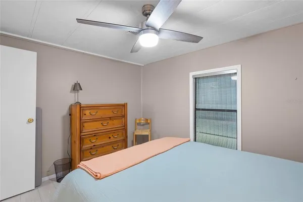 a bedroom with a bed and a dresser