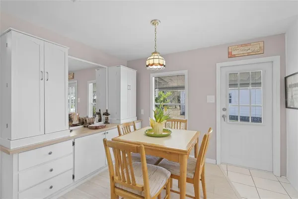 a dining room with furniture and window