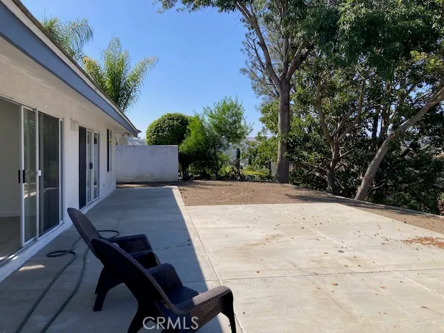 a wooden bench sitting in front of a building