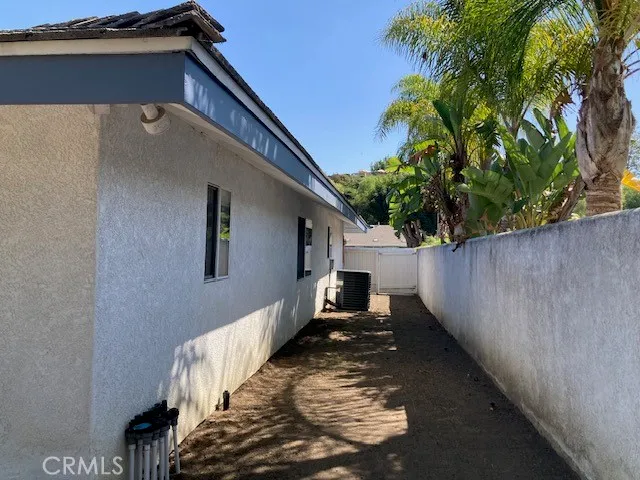 a view of a house with a small yard