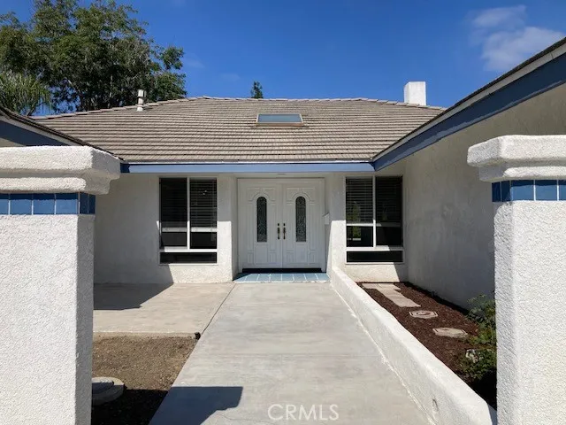 a front view of a house with large windows