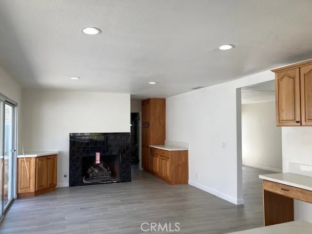 a view of room with furniture and wooden floor