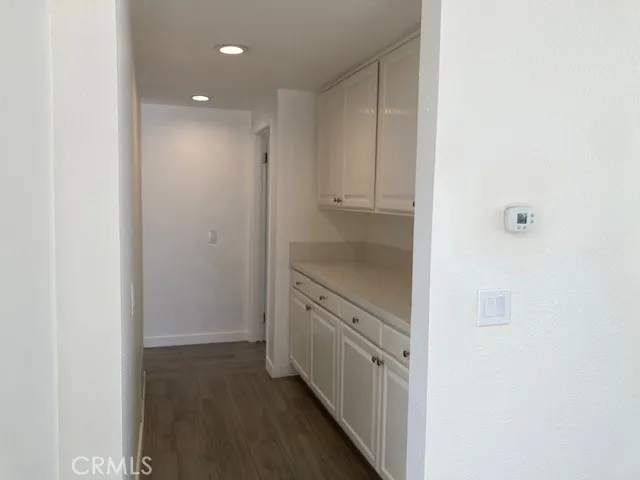 a hallway with cabinets