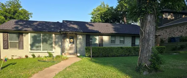 a view of a house with a garden