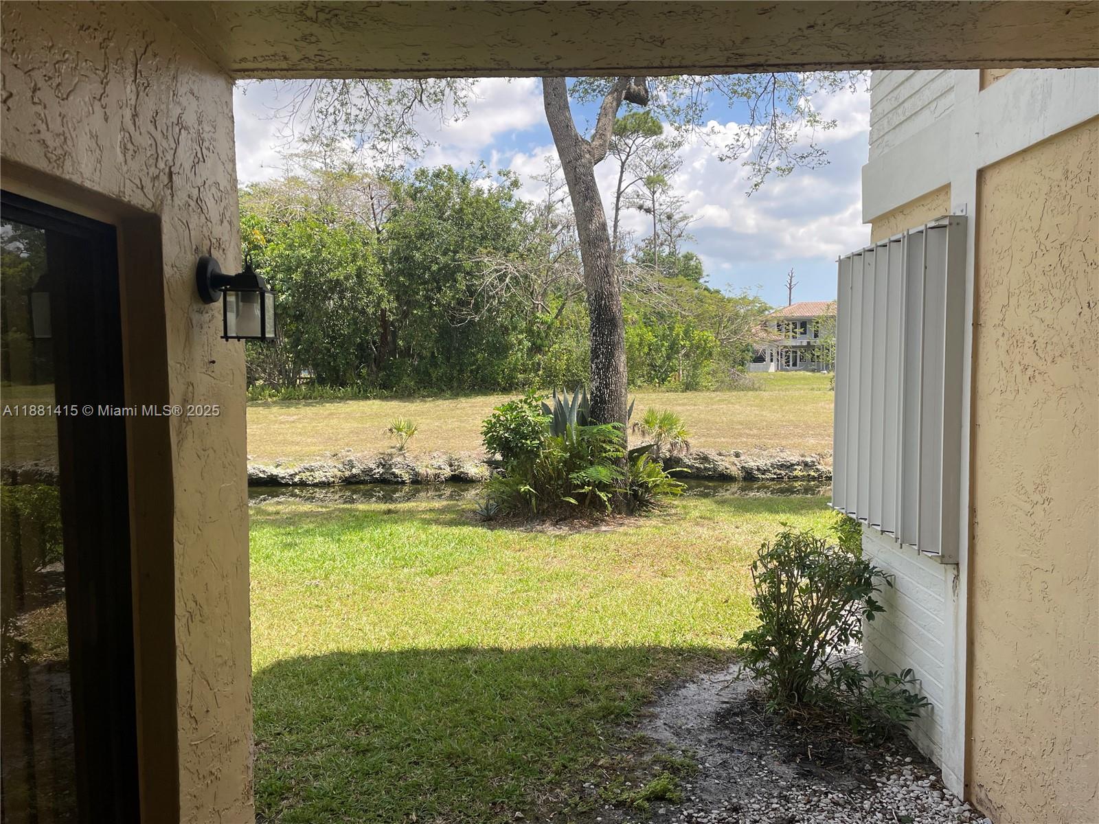 5661 Riverside Drive, Unit 101B7 Coral Springs, FL 33067 - Photo 11 of 60 a view of a back yard from a balcony