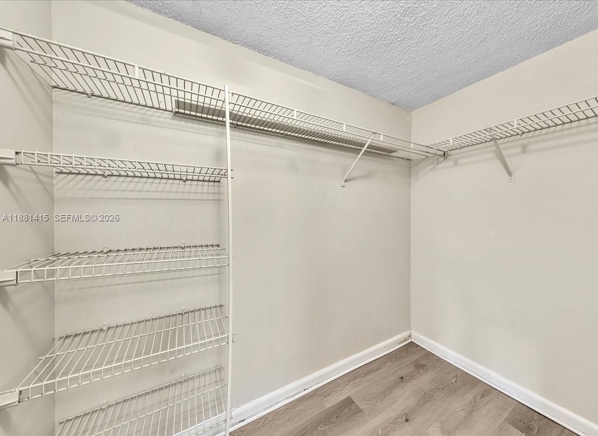 5661 Riverside Drive, Unit 101B7 Coral Springs, FL 33067 - Photo 28 of 49 a view of a room with racks on the wall