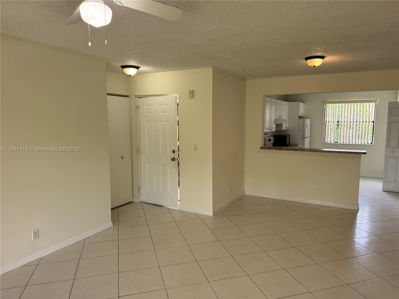 5661 Riverside Drive, Unit 101B7 Coral Springs, FL 33067 - Photo 3 of 60 a view of a livingroom with a furniture and window