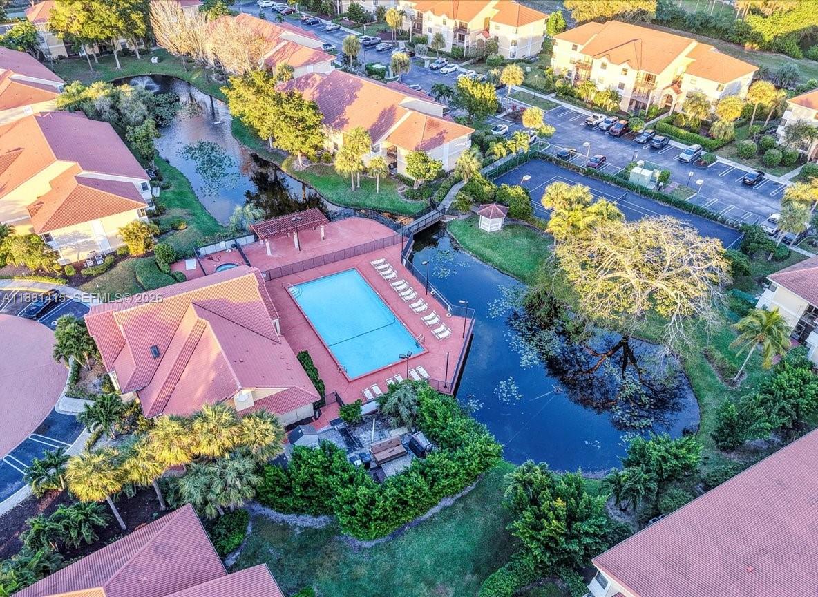 5661 Riverside Drive, Unit 101B7 Coral Springs, FL 33067 - Photo 43 of 49 an aerial view of a house with a yard and garden