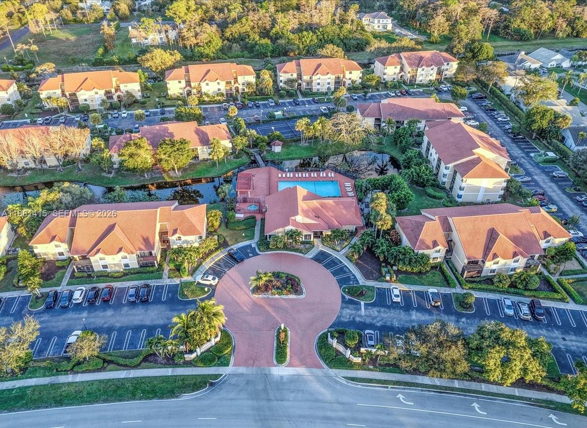 5661 Riverside Drive, Unit 101B7 Coral Springs, FL 33067 - Photo 44 of 49 an aerial view of residential house with outdoor space and swimming pool