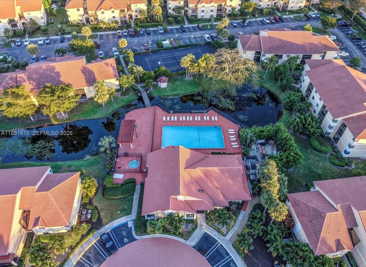 5661 Riverside Drive, Unit 101B7 Coral Springs, FL 33067 - Photo 45 of 49 an aerial view of a house with garden space and street view