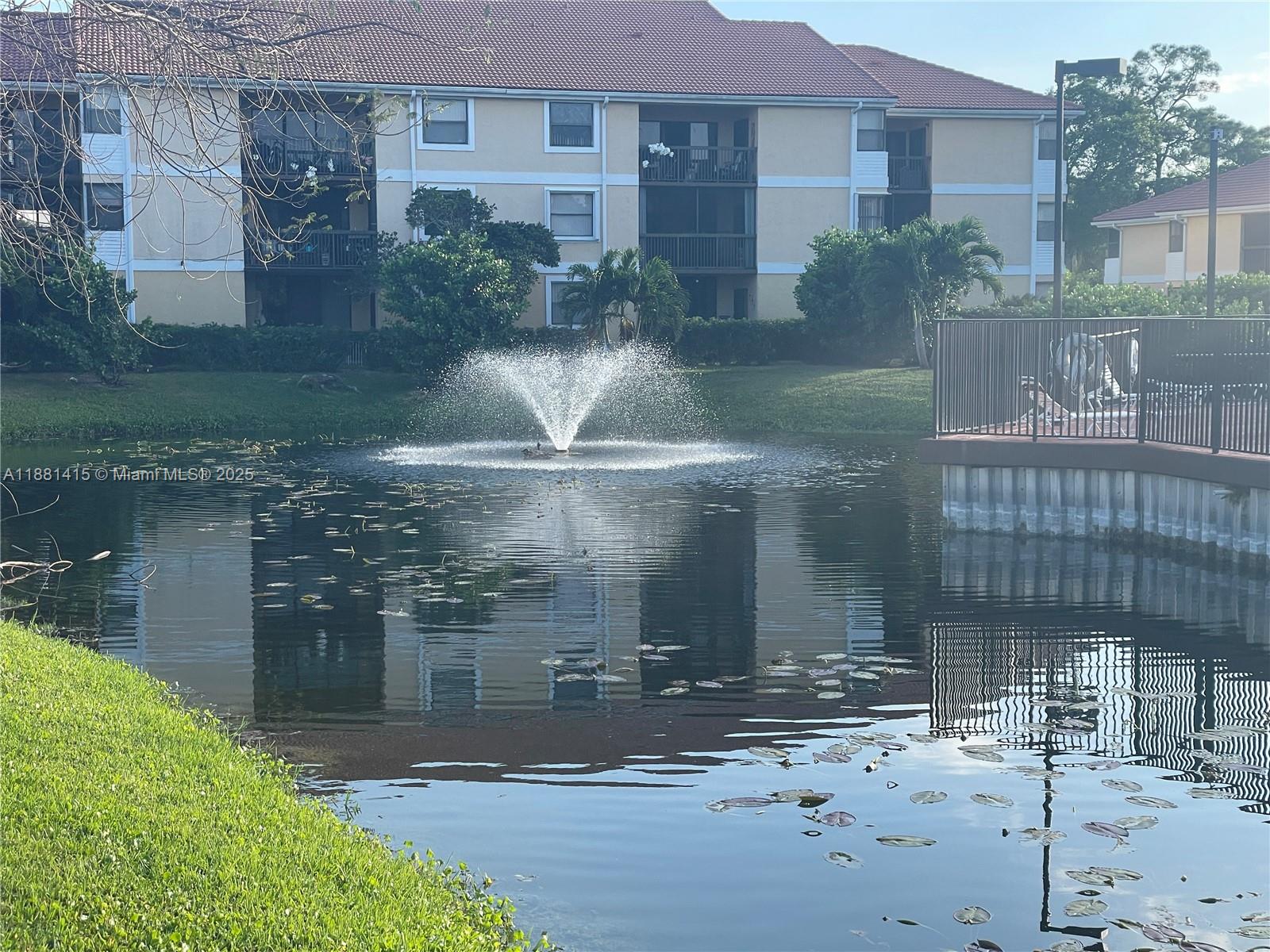 5661 Riverside Drive, Unit 101B7 Coral Springs, FL 33067 - Photo 46 of 60 a view of a brick building next to a yard