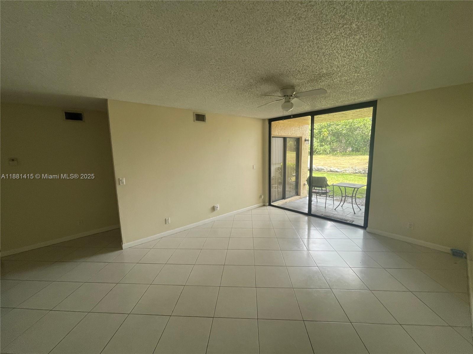 5661 Riverside Drive, Unit 101B7 Coral Springs, FL 33067 - Photo 10 of 60 a view of an empty room and window