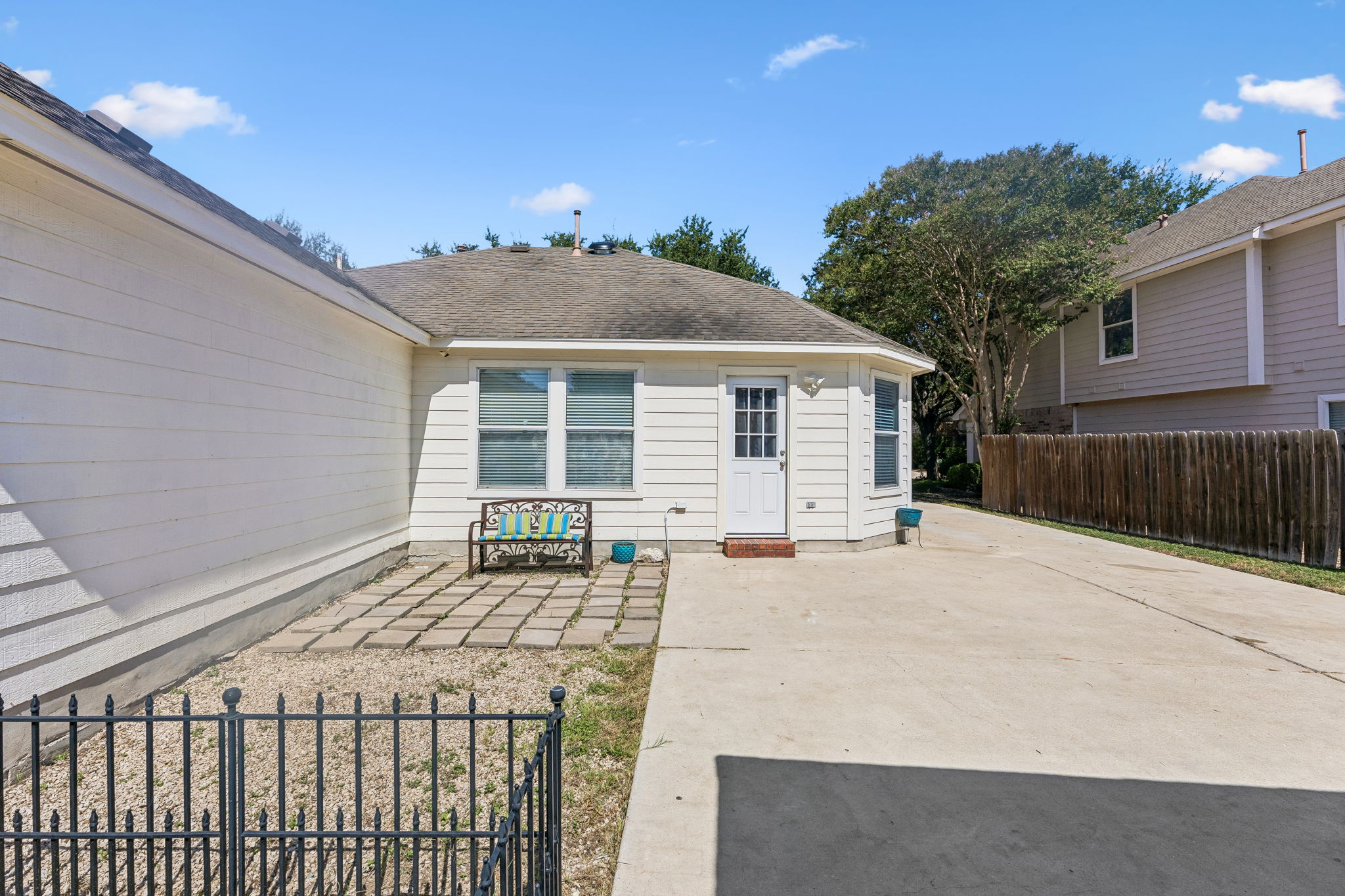 159 Invierno Street Kyle, TX 78640 - Photo 33 of 40 Out back, an alfresco courtyard patio between the home and yard provides space for relaxing outdoors, grilling out, and more.