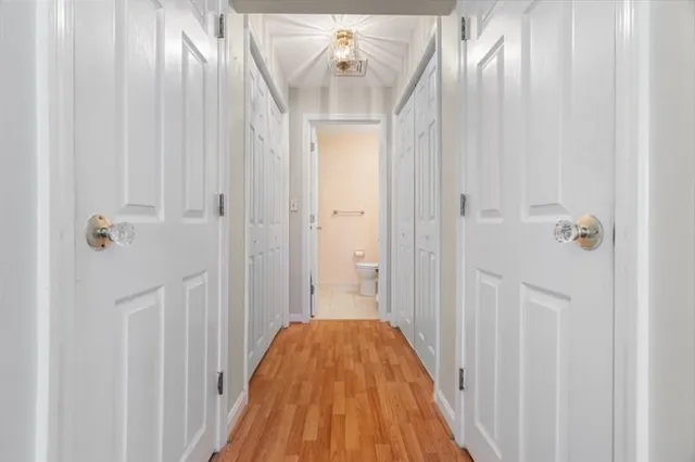 a view of a bathroom from a hallway