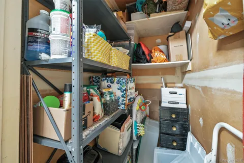 a view of bathroom with shower and a window
