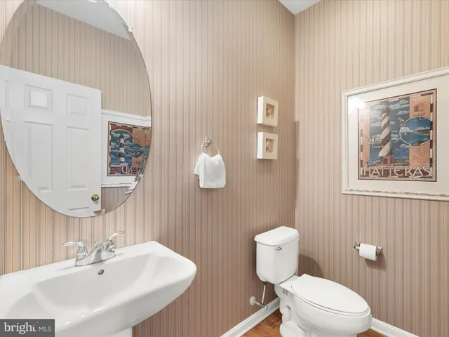 a kitchen with granite countertop white cabinets a sink and dishwasher
