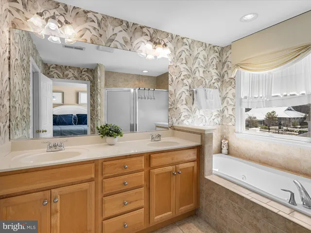 a view of a two chairs and table in the balcony