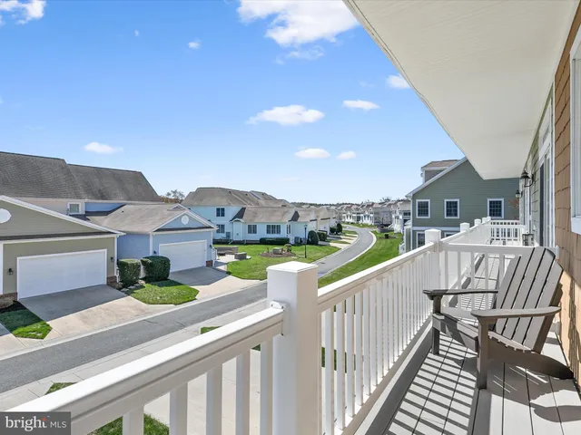 a view of a balcony with furniture