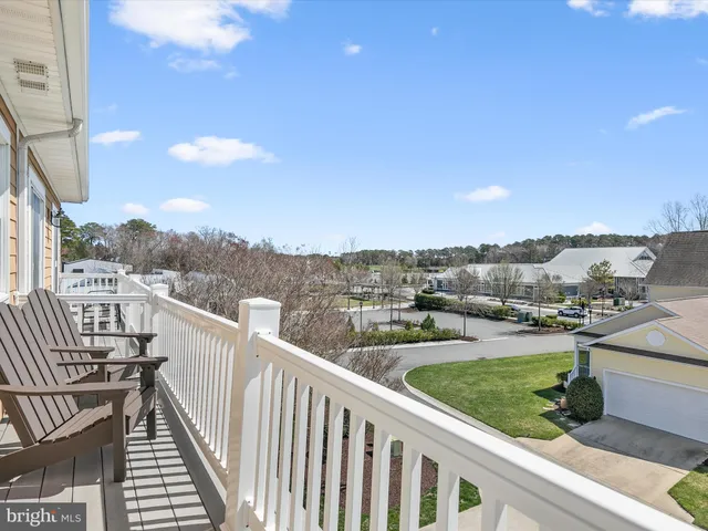 a view of a lake with houses in the back