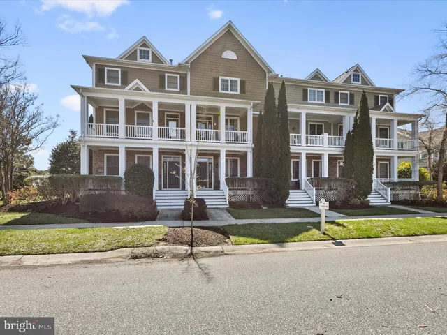 a view of a patio with a table and chairs