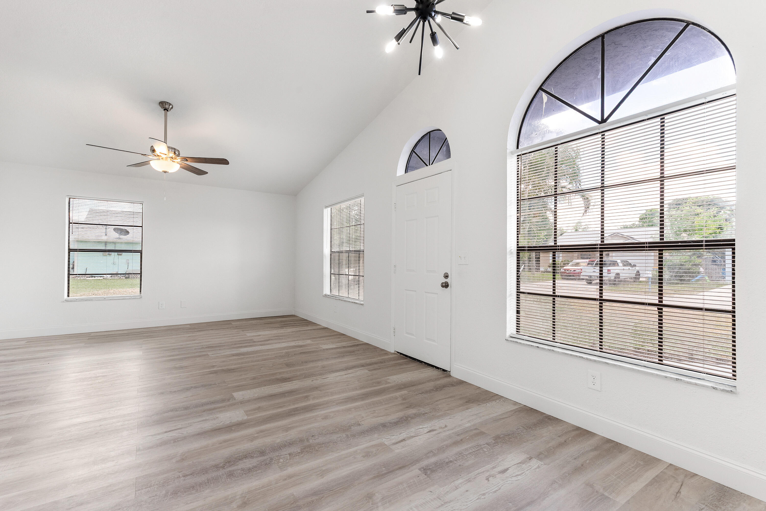 5629 Southeast Collins Avenue Stuart, FL 34997 - Photo 18 of 39 a view of an entryway with wooden floor