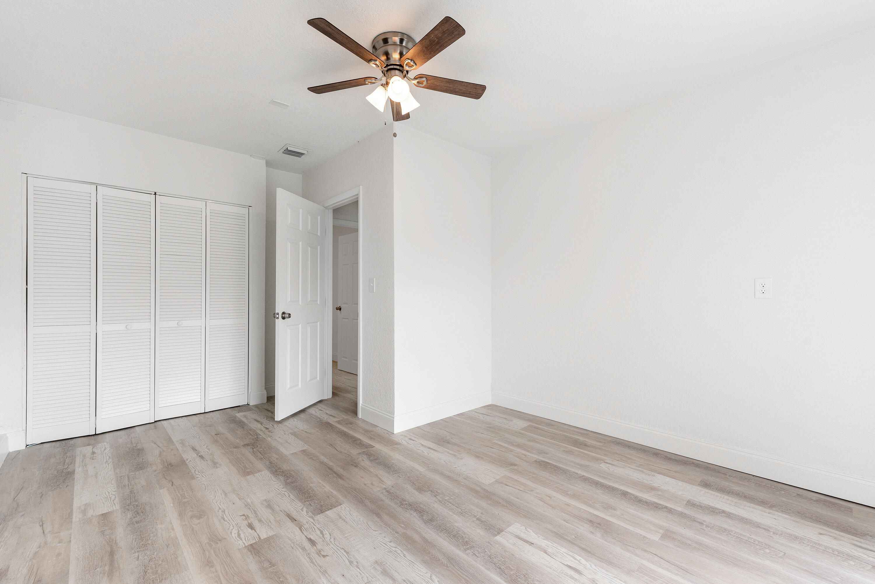 5629 Southeast Collins Avenue Stuart, FL 34997 - Photo 19 of 39 a view of a big room with wooden floor