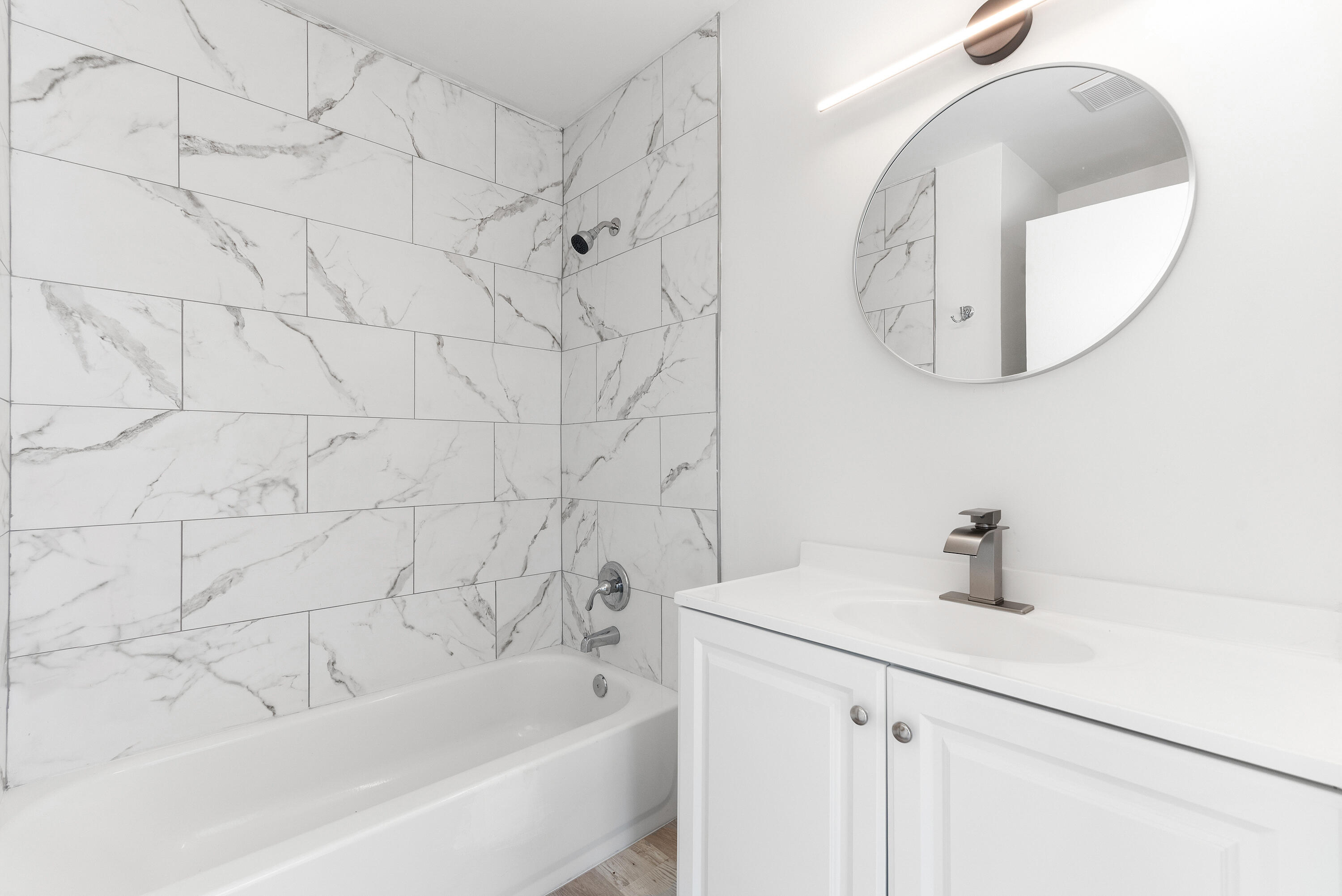 5629 Southeast Collins Avenue Stuart, FL 34997 - Photo 23 of 39 a bathroom with a sink and a mirror